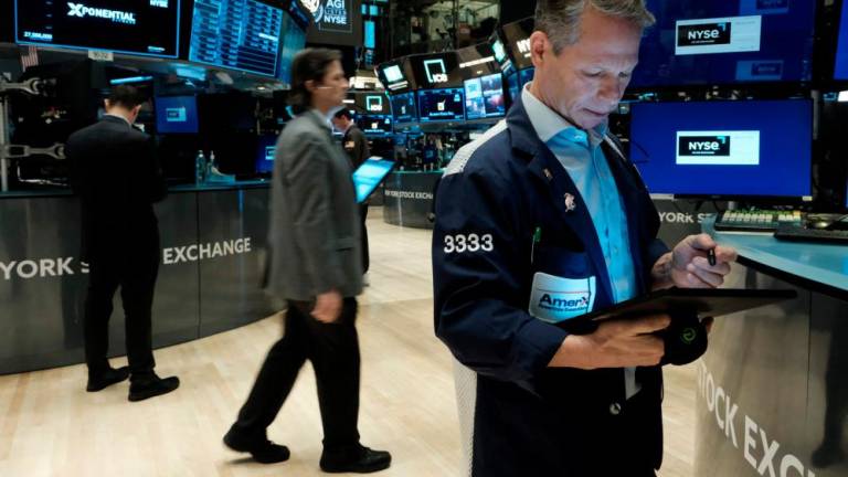 Traders working on the floor of the New York Stock Exchange on Wednesday, Feb 8. – AFPpic