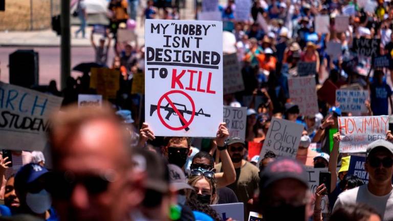 Demonstrators join the March for Our Lives rally in Los Angeles, California, on June 11, 2022. Protesters are demonstrating across the US for tighter firearms laws to curb devastating gun violence plaguing the country. AFPPIX