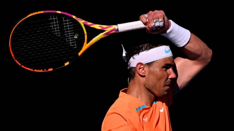Spain's Rafael Nadal returns to Britain's Jack Draper during their men's singles match on day one of the Australian Open tennis tournament in Melbourne on January 16, 2023/AFPPix