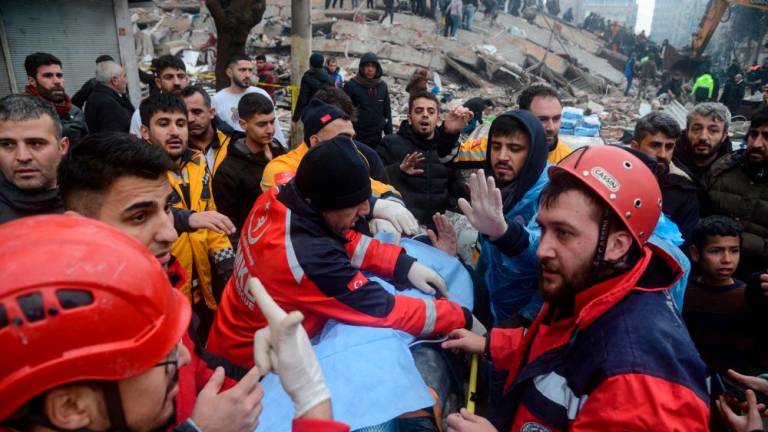 Rescue workers and volunteers pull out a survivor from the rubble in Diyarbakir on February 6, 2023, after a 7.8-magnitude earthquake struck the country’s south-east. AFPPIX