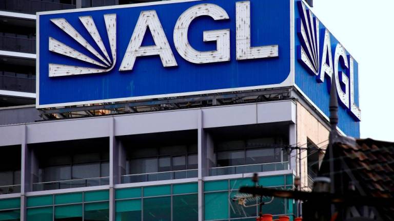 The logo of AGL Energy adorns the company’s head office in Sydney. AGL will present its new strategy and an earnings forecast for the year in September. – Reuterspix