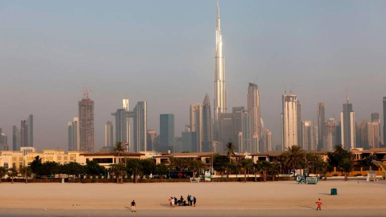 People gather at a beach in the Gulf emirate of Dubai, on September 15, 2022. AFPPIX