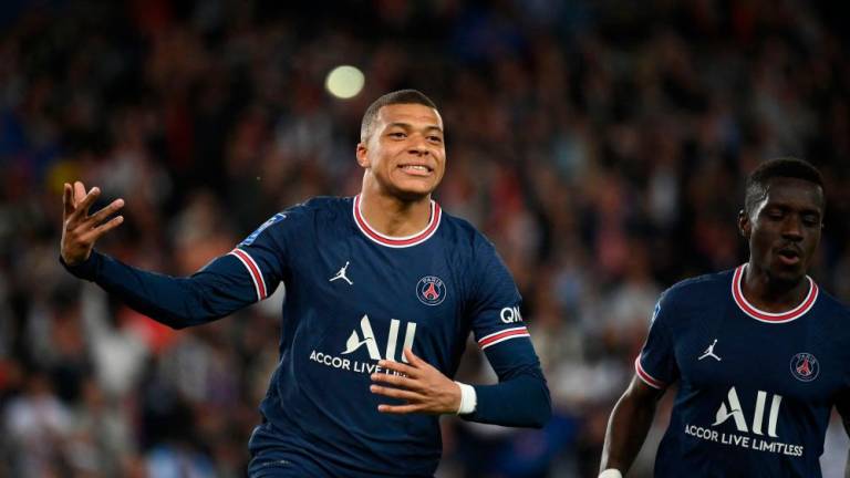 (FILES) Paris Saint-Germain's French forward Kylian Mbappe celebrates scoring his team's second goal during the French L1 football match between Paris-Saint Germain (PSG) and Olympique Marseille (OM) at The Parc des Princes Stadium in Paris on April 17, 2022. AFPPIX