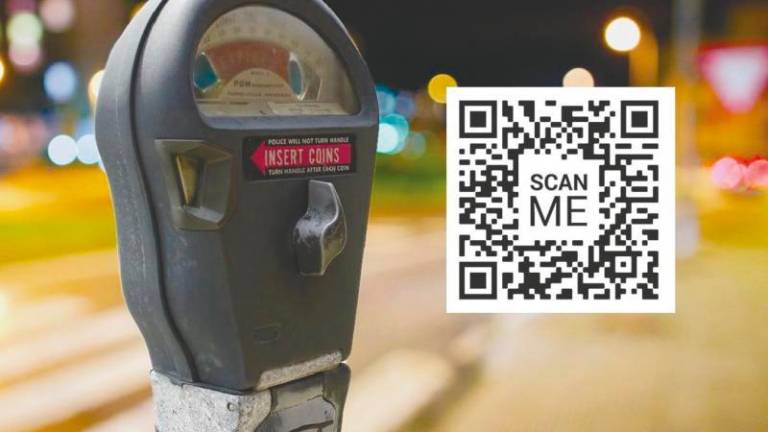 Scammers are putting fake QR codes on parking meters.