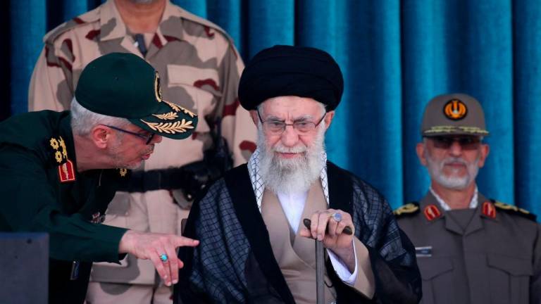 A handout picture provided by the office of Iran's Supreme Leader Ayatollah Ali Khamenei on Octobre 3, 2022, shows him attending a joint graduation ceremony for cadets of armed forces academies in the capital Tehran. - AFPPIX