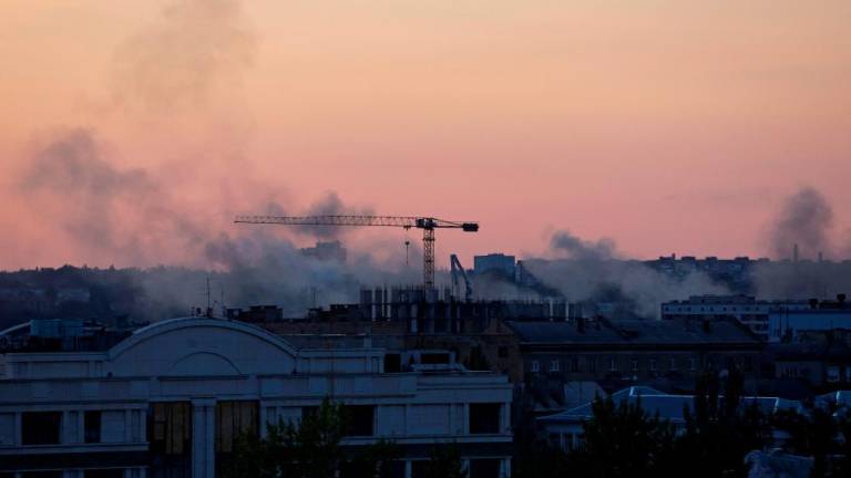 Smoke rises above buildings following a shelling in the course of Russia-Ukraine conflict in Donetsk, Russian-controlled Ukraine, September 10, 2023. REUTERS