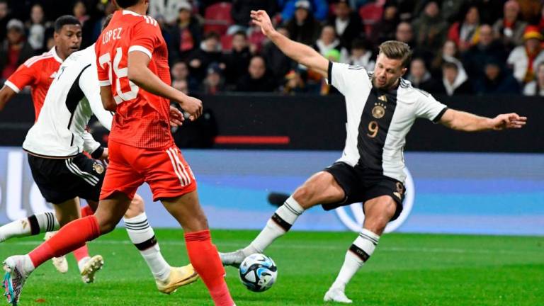 Germany’s forward Niclas Fuellkrug (R) scores the opening goal during the international friendly football match Germany v Peru in Mainz, southern Germany, on March 25, 2023. AFPPIX