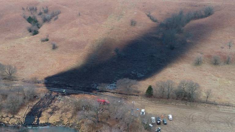 Emergency crews work to clean up the largest U.S. crude oil spill in nearly a decade, following the leak at the pipeline operated by TC Energy in rural Washington County, Kansas, U.S., December 9, 2022/REUTERSPix