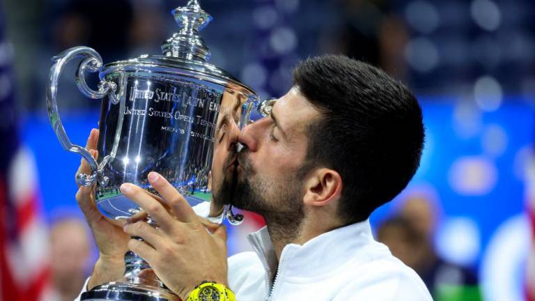 Tennis - US Open - Flushing Meadows, New York, United States - September 10, 2023Serbia's Novak Djokovic celebrates with the trophy after winning the US Open REUTERSPIX