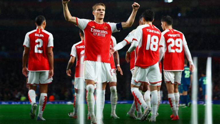Martin Odegaard celebrates scoring the team’s fourth goal during the UEFA Champions League Group B football match between Arsenal and PSV Eindhoven at the Arsenal Stadium in north London on September 20, 2023. AFPPIX