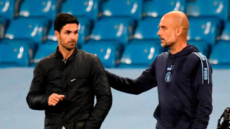 FILE PHOTO/Manchester City manager Pep Guardiola and Arsenal manager Mikel Arteta/REUTERSPIX