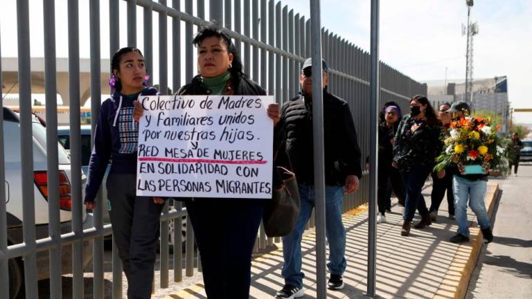 A group of activists support migrants during a protest outside an immigration detention center in Ciudad Juarez, Chihuahua state, Mexico, on March 28, 2023/AFPPix