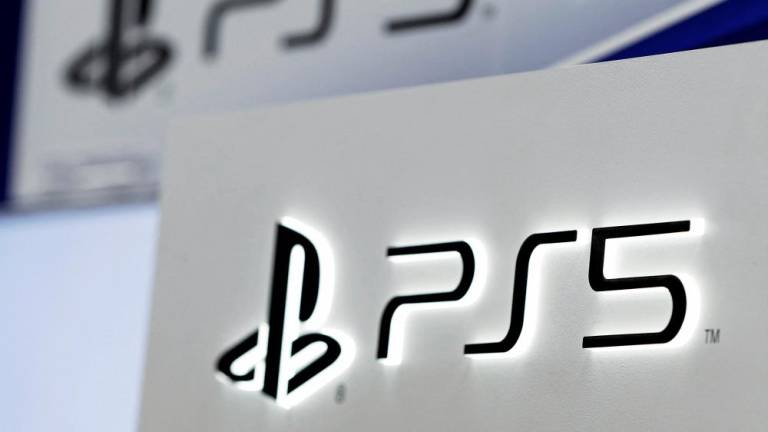 FILE PHOTO: The logos of Sony's PlayStation 5 are displayed at the consumer electronics retailer chain Bic Camera, ahead of its official launch, in Tokyo, Japan November 10, 2020. REUTERS/Issei Kato//File Photo