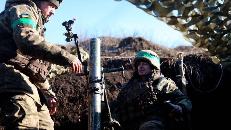 Ukrainian servicemen fire with mortars from their position not far from Bakhmut, Donetsk region on January 27, 2023, amid Russian invasion of Ukraine. AFPPIX