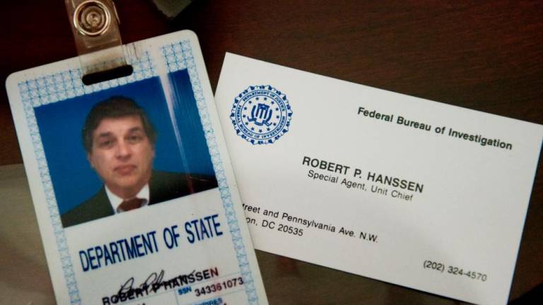 The identification and business card of former FBI agent Robert Hanssen are seen inside a display case at the FBI Academy in Quantico, Virginia, on May 12, 2009/AFPpix