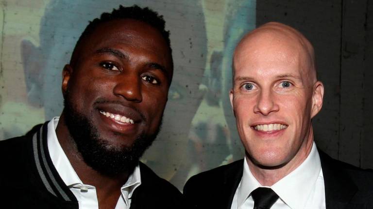 In this file photo taken on January 9, 2017, US sportswriter Grant Wahl (R) and US football player Jozy Altidore (L) attend the 2017 St. Luke Foundation for Haiti Benefit hosted by Kenneth Cole at the Garage in New York City/AFPPix