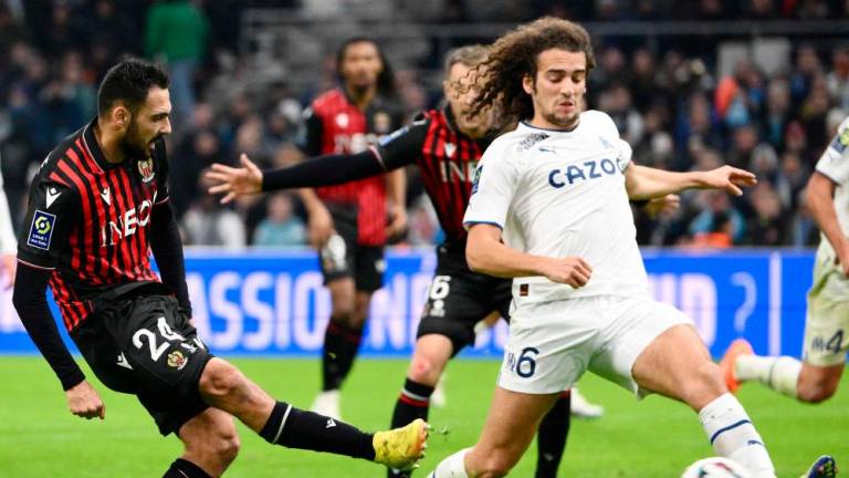 Nice’s French forward Gaetan Laborde (L) scores the second goal next to Marseille’s French midfielder Matteo Guendouzi (R) during the French L1 football match between Olympique Marseille (OM) and OGC Nice at Stade Velodrome in Marseille, southern France on February 5, 2023/AFPPix