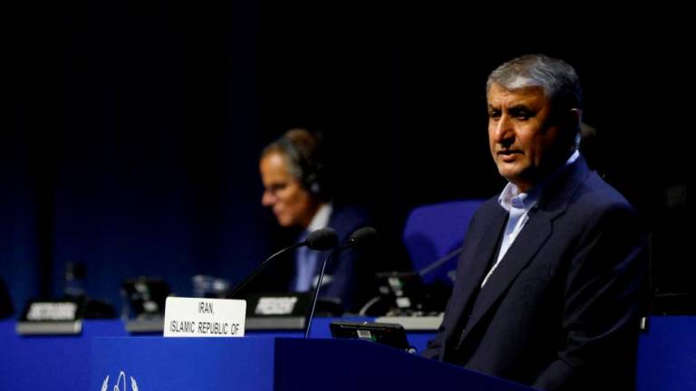 Head of Atomic Energy Organization of Iran Mohammad Eslami and International Atomic Energy Agency Director General Rafael Grossi attend the opening of the IAEA General Conference at their headquarters in Vienna, Austria, September 26, 2022. REUTERSPIX