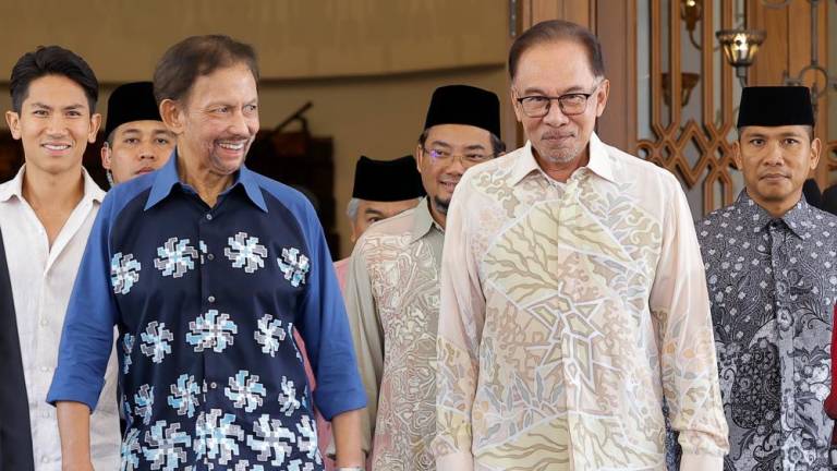 Sultan Brunei Sultan Hassanal Bolkiah (third, left) departing back to Brunei while being escorted by Prime Minister Datuk Seri Anwar Ibrahim (second, right) on Nov 28 2022 - BERNAMAPIX