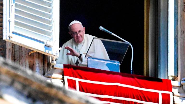 Pope Francis waves as he addresses to the crowd during his Angelus prayer from the window of the apostolic palace overlooking St. Peter’s Square, at the Vatican, on July 31, 2022. AFPPIX