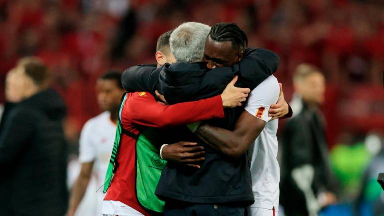 Jose Mourinho and Tammy Abraham celebrate after the match. - REUTERSPIX