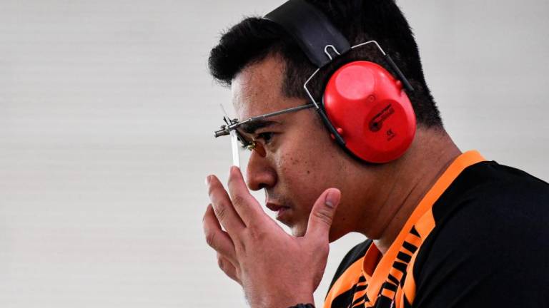 HANOI, May 16-National shooting athlete, Hafiz Adzha while competing in the Men’s 25 meter Rapid Fire Pistol event in conjunction with the 31st SEA Games at the Hanoi National Sports Training Center today. He managed to win a Silver medal in the event. BERNAMAPIX