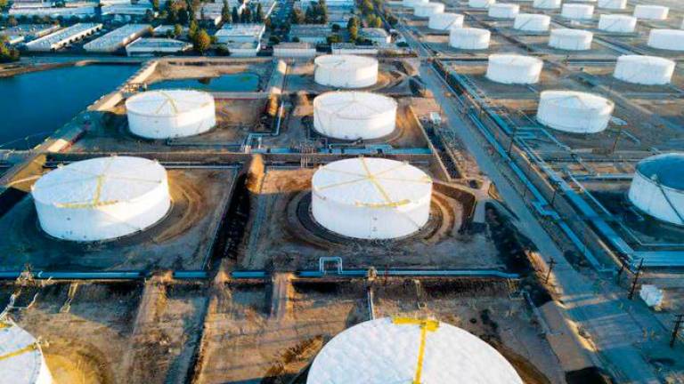 Oil storage tanks are seen from above in Carson, California. Opec’s EIA expects global oil inventories to decline by almost a half million bpd in the second half of 2023, causing oil prices to rise with Brent averaging US$93 per barrel in the fourth quarter. – AFPpic