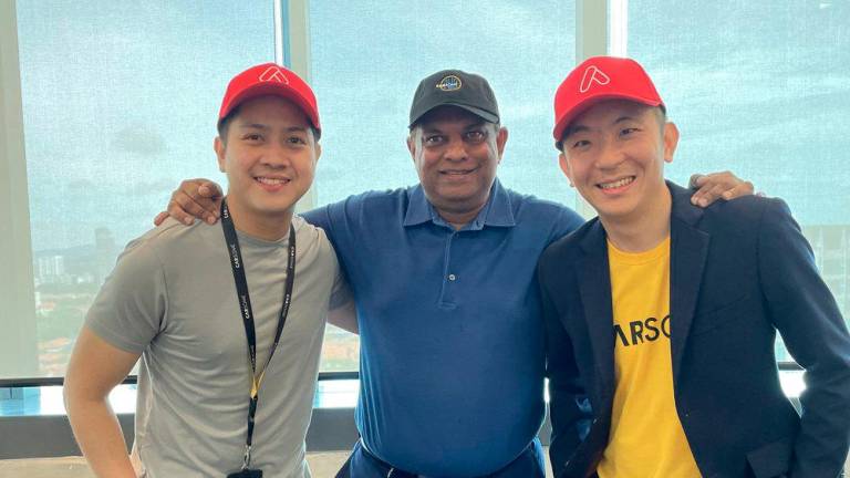 Carsome co-founder and Carsome Academy director Teoh Jiun Ee (left), Fernandes (middle) and Cheng during AirAsia Academy’s visit to Carsome’s headquarters.