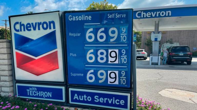 Petrol prices are advertised at a Chevron station in Los Angeles, California, in June 2022. Data shows a larger-than-expected draw in petrol stocks, implying strong demand heading into the summer season. – Reuterspic