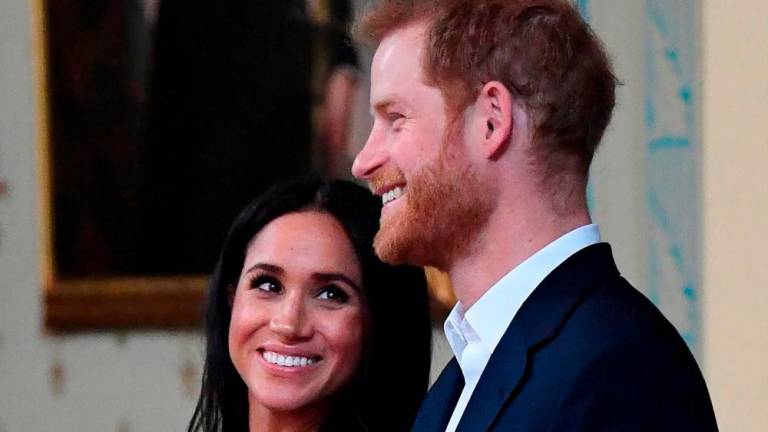 Three of the messages featured racist comments about Meghan Markle, Prince Harry’s wife. AFPPIX