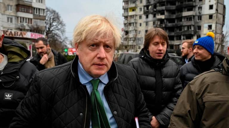 Former British Prime Minister Boris Johnson visits the town of Borodianka, heavily damaged during Russia’s invasion of Ukraine, outside of Kyiv, Ukraine January 22, 2023. REUTERSpix