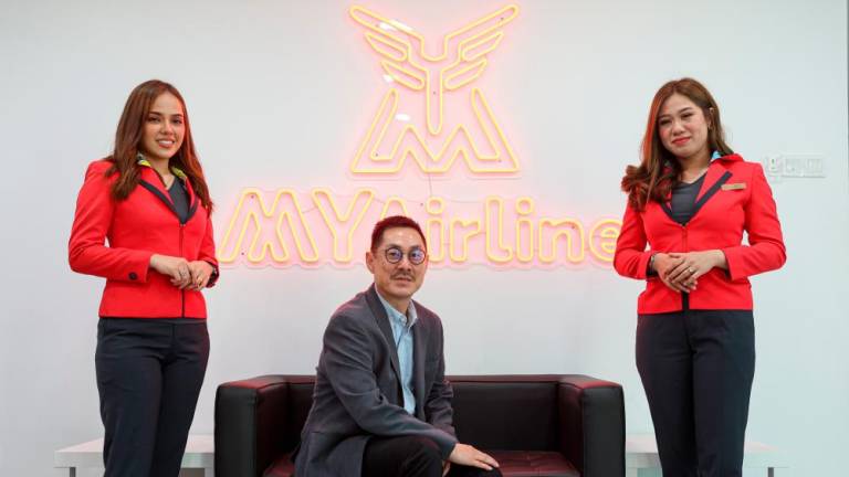MYAirline Chief Executive Officer Rayner Teo (middle) with MYAirline cabin crew during a photosession at MYAirline Media Roundtable Session and Inaugural Flight to Langkawi at SS15 Courtyard, Subang Jaya today/BERNAMAPix
