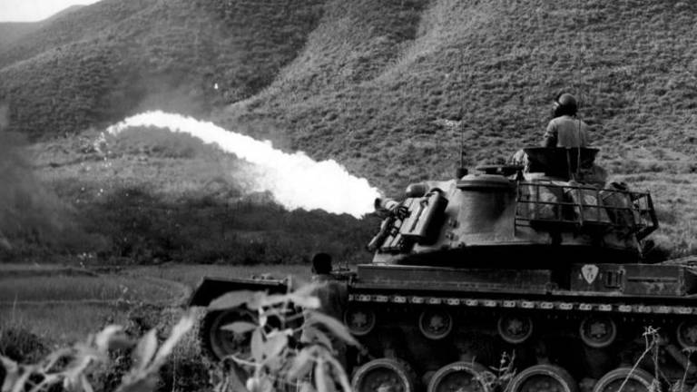 FILE PHOTO: A US Marine tank launches flamethrower in action near Da Nang, Vietnam, 1965. REUTERSPIX