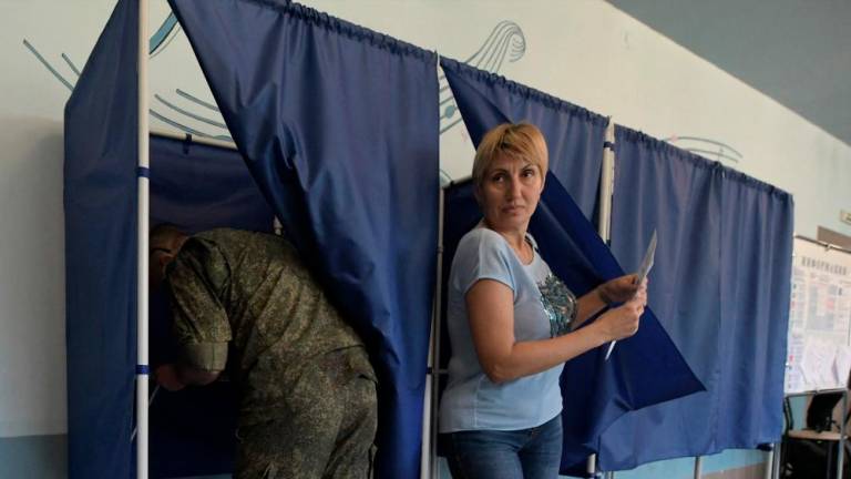 People vote at a polling station during local elections organised by the Russian-installed authorities in Donetsk, Russian-controlled Ukraine, on September 8, 2023. AFPPIX