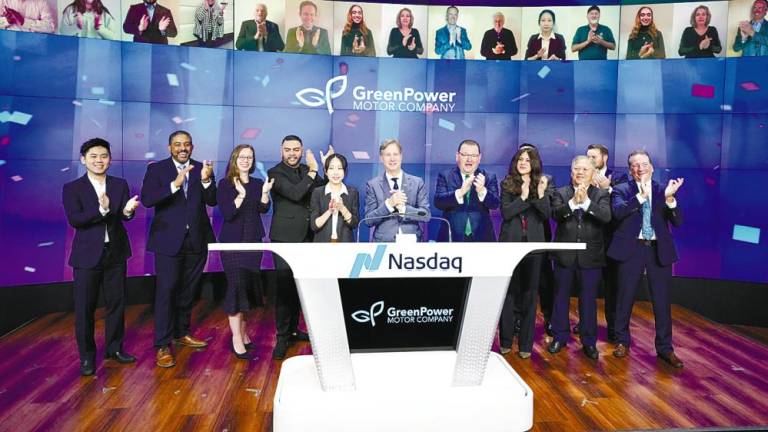 Gemilang International Ltd business development manager Joseph Lee (left), Atkinson (sixth from left), Greenpower vice-president of business development &amp; strategy Mark Nestlen (seventh from left) and Pang (ninth from left) stand alongside each other at the Nasdaq opening bell ceremony held at Nasdaq Marketsite in New York.