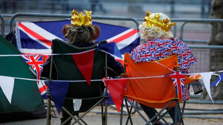 Royal fans wait at the Mall, ahead of the Coronation of Britain’s King Charles and Camilla, Queen Consort, in London, Britain May 4, 2023. REUTERSpix