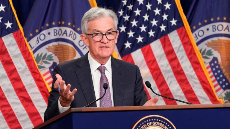 Powell speaking at a news conference after the Federal Reserve raised its target interest rate by three-quarters of a percentage point in Washington on Wednesday, Sept 21. – Reuterspix