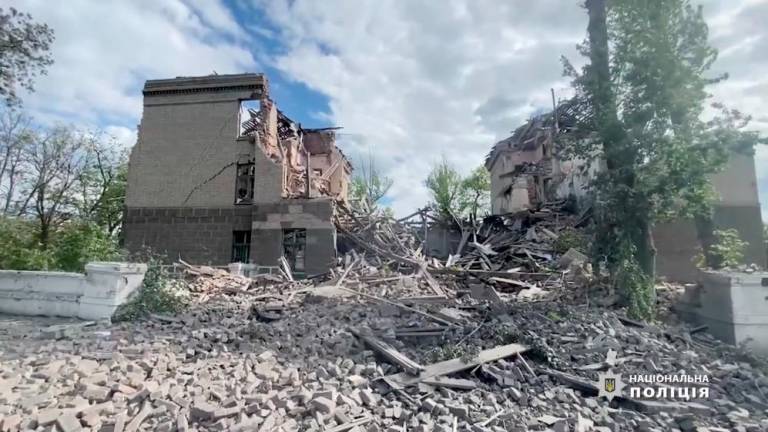 View of a damaged building after it was struck, by what was reported to be an air strike, during Russia's invasion of Ukraine, in Bakhmut, Donetsk Region, Ukraine, in this screengrab obtained from a social media video released May 19, 2022 Donetsk Region Police/Handout via REUTERSpix