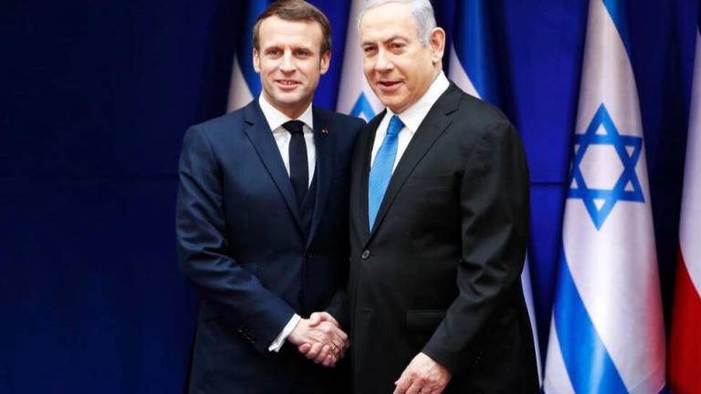 Netanyahu (R) hopes to discuss Iran while Macron is concerned about the Israeli-Palestinian conflict. AFPPIX