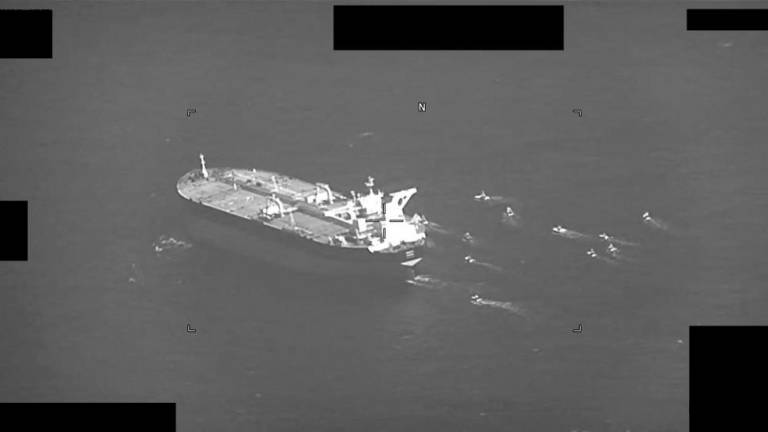 This US Navy handout screenshot of a video shows fast-attack craft from Iran’s Islamic Revolutionary Guard Corps Navy swarming Panama-flagged oil tanker Niovi as it transits the Strait of Hormuz on May 3, 2023. AFPPIX