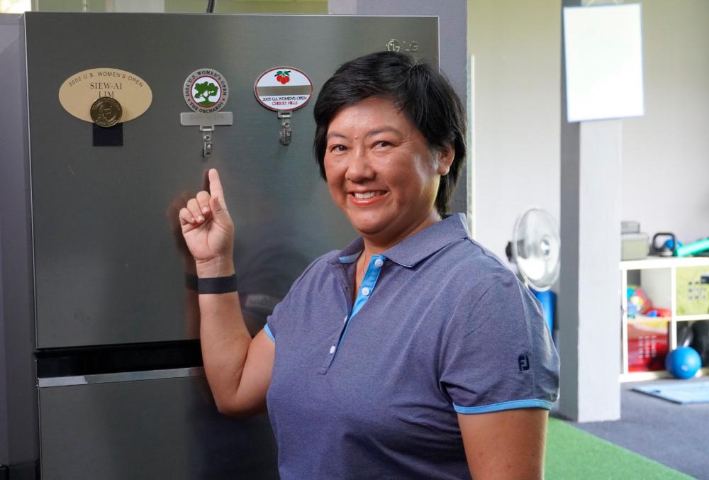 Lim Siew Ai with mementoes from her past US Women’s Open appearances.