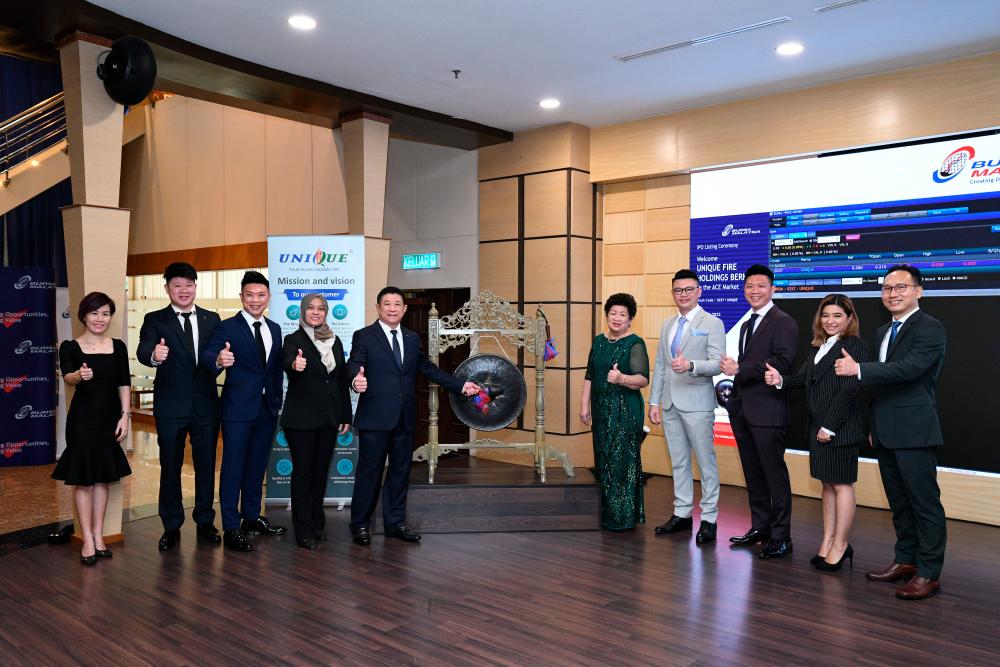 From left: Unique Fire Holdings Bhd directors Andrea Huong, Ray Liew, Roy Liew, chairperson Selma Enolil Mustapha Khalil, managing director Liew Sen Hoi, promoter Lim Show Ching, directors Datuk Marcus Liew, Ryan Liew, Olivia Lim and Tee Kiam Hong at the listing ceremony
