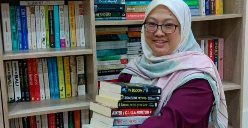 Noreen with some of the books she has for sale. – Wan Noreen Wan Ahmad
