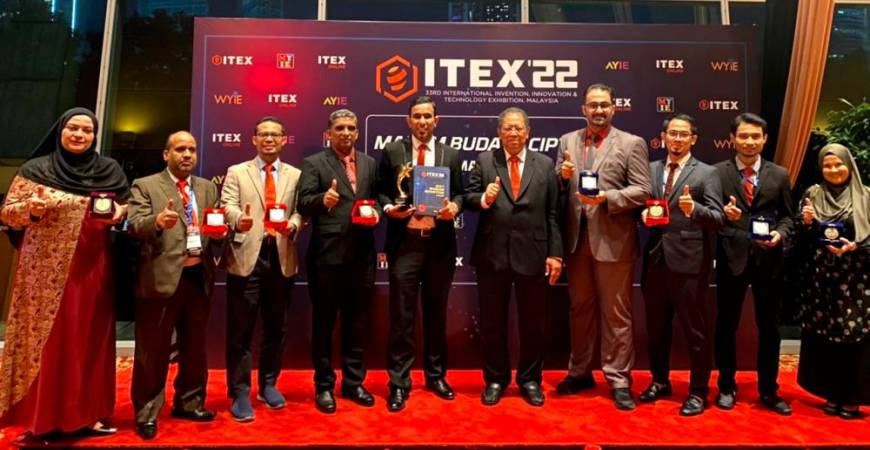 MSU researchers team for ITEX 2022 with their medals.