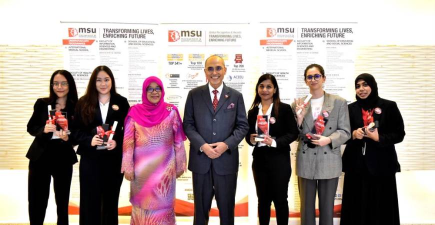 Prof Tan Sri Dr Mohd Shukri (four from right) and Prof Puan Sri Dr Junainah with among the President List Award recipients.