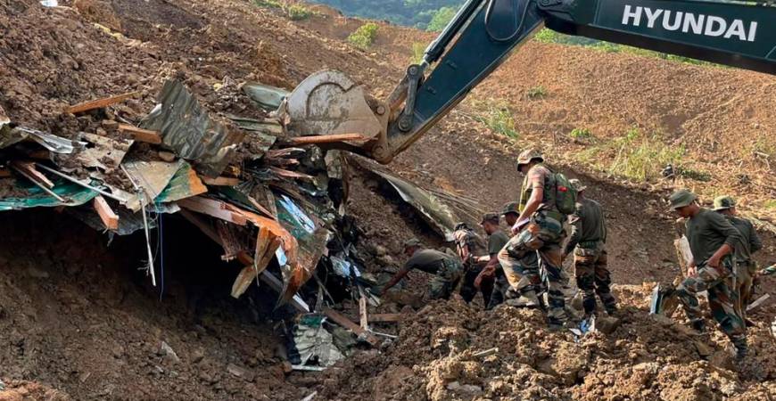 In this handout photo released by the Indian Army and taken on July 1, 2022, security forces and disaster relief teams search for survivors and victims after a landslide in Noney district, some 50 Km from Manipur's capital Imphal. INDIAN ARMY/AFPpix