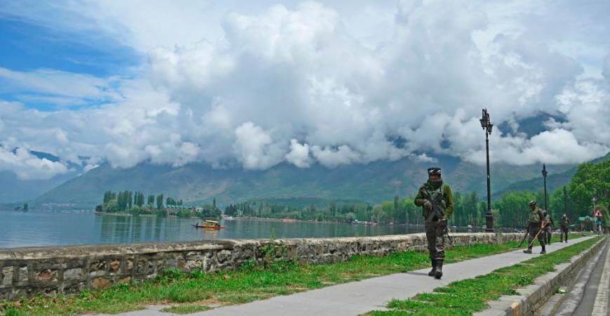 Indian paramilitary troopers patrol along the banks of Dal Lake in Srinagar on May 3, 2023. AFPPIX