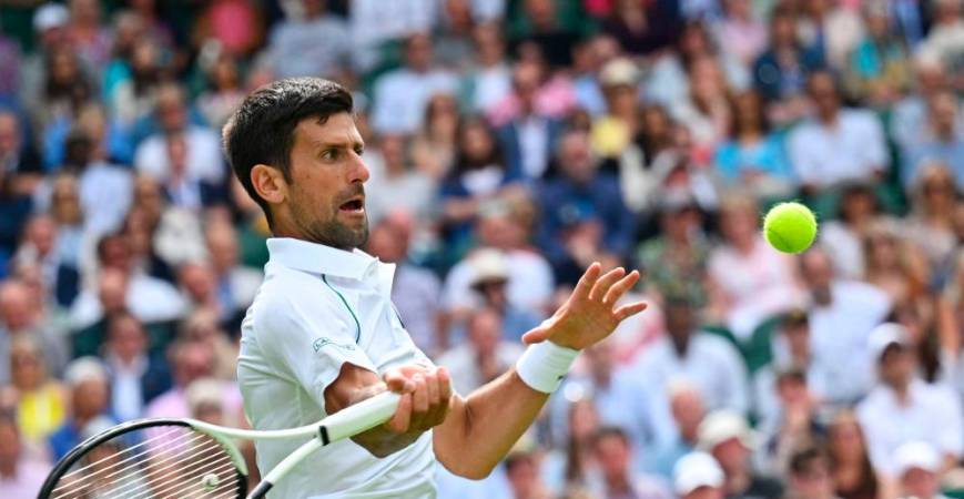 Serbia’s Novak Djokovic returns the ball to Australia’s Thanasi Kokkinakis during their men’s singles tennis match on the third day of the 2022 Wimbledon Championships at The All England Tennis Club in Wimbledon, southwest London, on June 29, 2022. AFPPIX