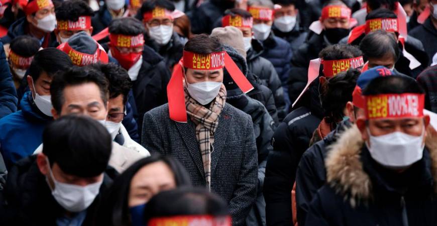 South Korean business owners attend a protest against the government’s new social distancing rules which came into effect earlier this month near the National Assembly in Seoul, South Korea, January 25, 2022. REUTERSpix
