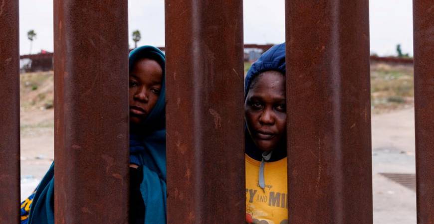 Migrants from Cameroon gather between the primary and secondary border fences between Mexico and the United States as they await processing by U.S. immigration in San Diego, California, U.S., September 22, 2023. REUTERSPIX